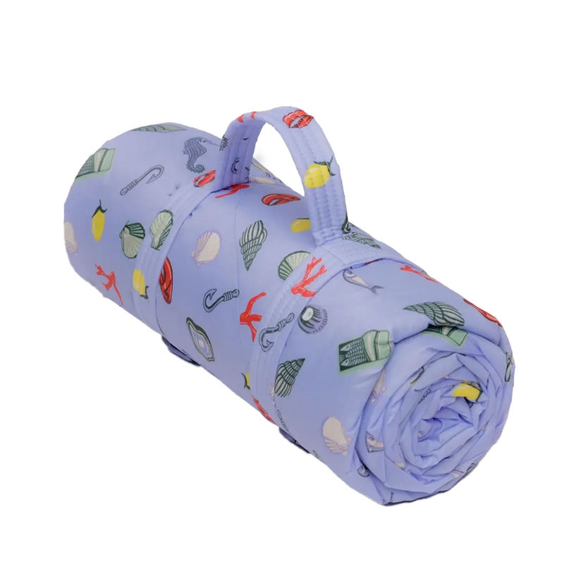  Puffy Picnic Blanket, Sea Charms by Baggu, rolled with a carry strap 