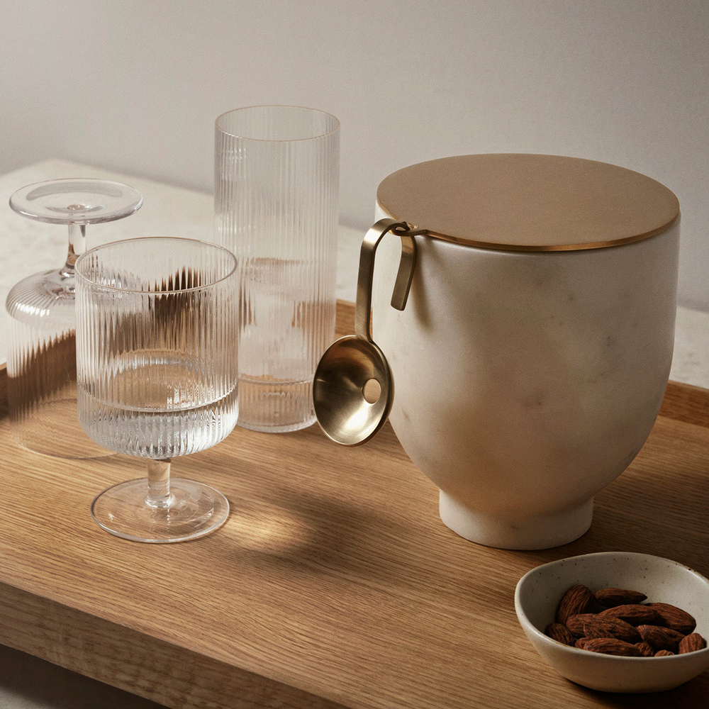 Ripple Wine Glasses, Set of 2, Clear by ferm LIVING, on a wooden table with a jug