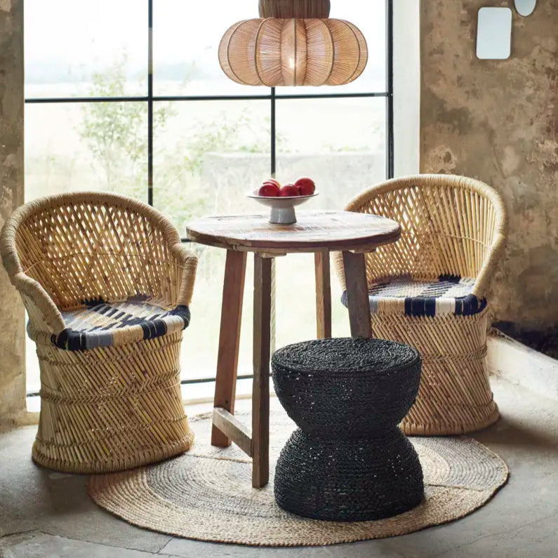 Round Handwoven Jute Rug, Natural & Grey by Madam Stoltz, under a rattan table setting