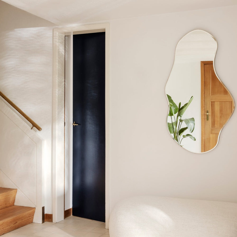 Pond Mirror, Large, Brass by ferm LIVING, in a hallway