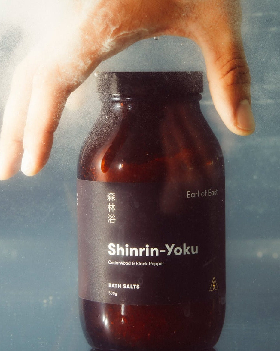 Shinrin-Yoku Bath Salts, 500g by Earl of East, bottle held underwater
