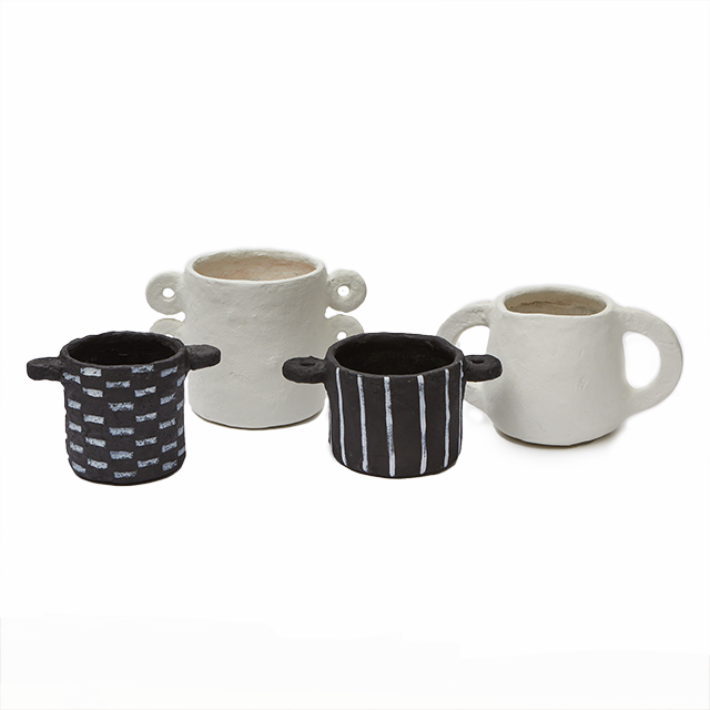 Papier-Mâché Pot, Beige Large Handle by Serax, with other pots on a shelf