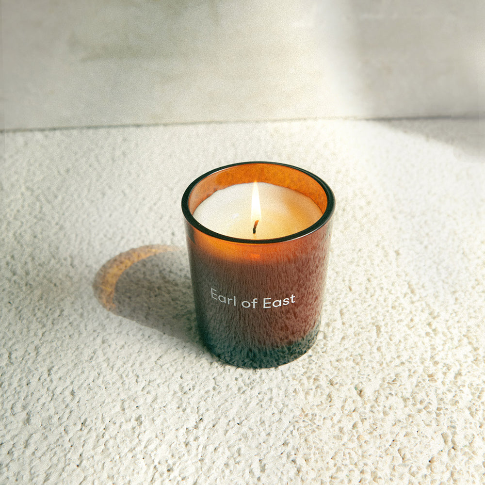 Viagem, Soy Wax Candle, 260ml [9.1oz] by Earl of East, lit on a white surface