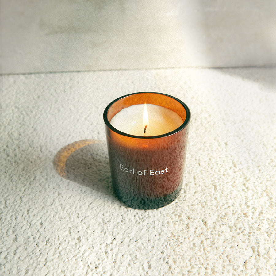 Viagem, Soy Wax Candle, 260ml [9.1oz] by Earl of East, lit on a white surface