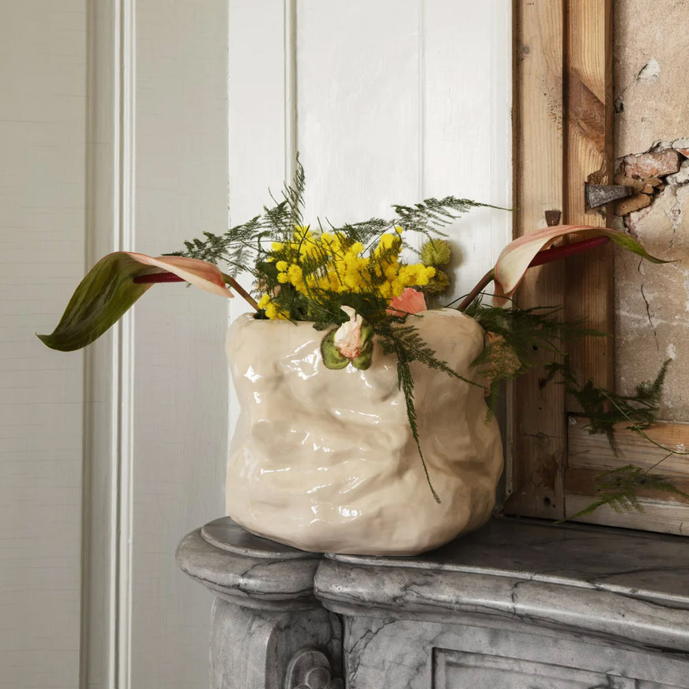 Tuck Pot, Cashmere by ferm LIVING, holding flowers on a mantelpiece